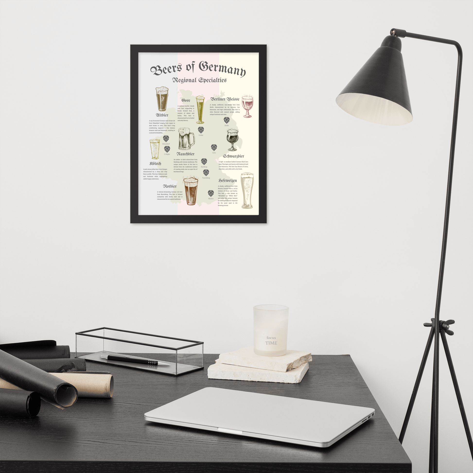 German beer map art print in a black wooden frame hanging above a desk.