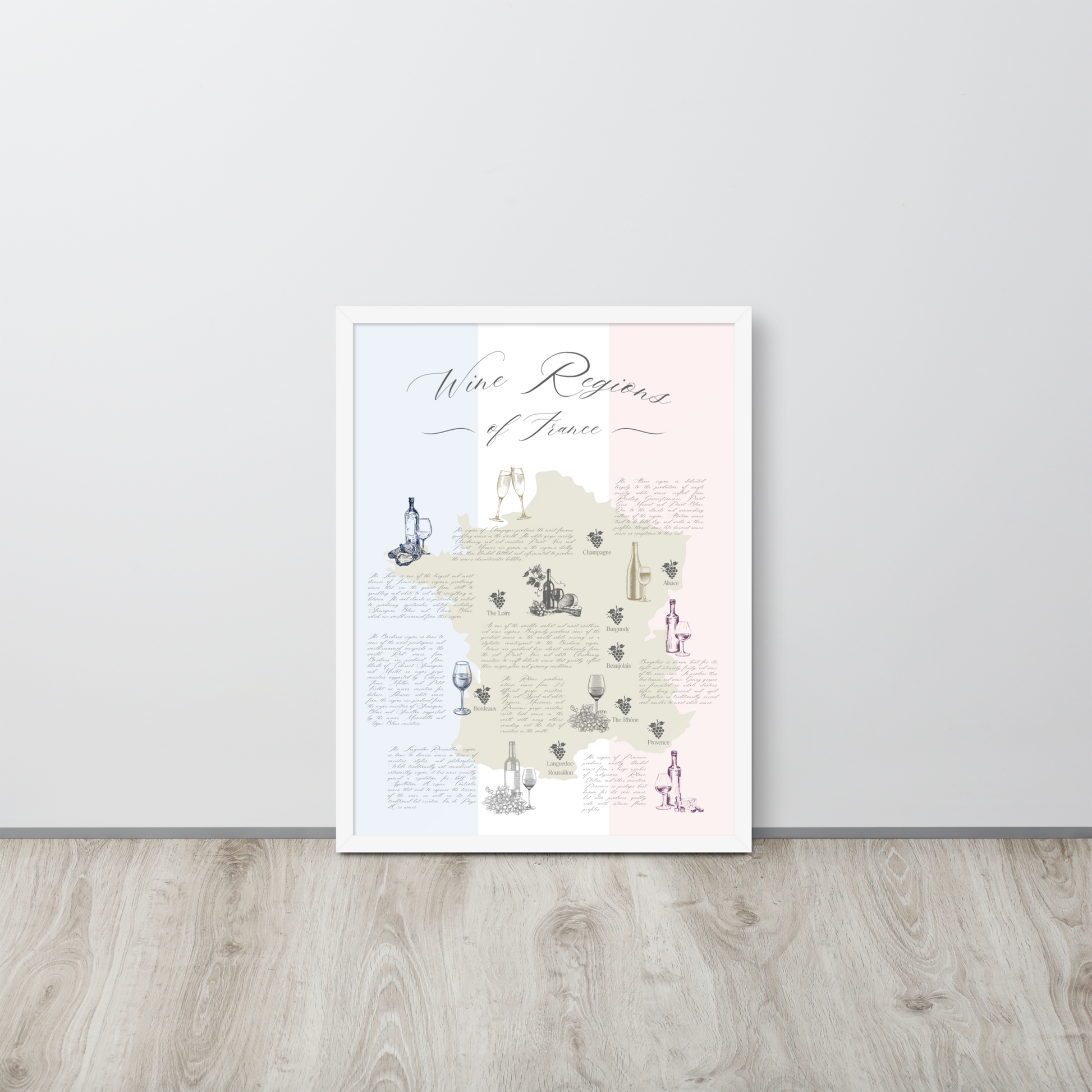 French wine map art print in a white wooden frame resting on the ground against the wall.